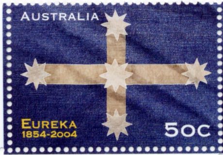 Australia-2004-Eureka-1854-2004-50-cent-Multi-P13-86-x-14-4-Blue-Eureka-flag-with-white-square-cross-and-stars-at-ends-of-cross-SG2396