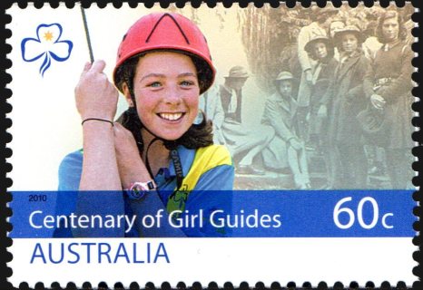 Australia-2010-Girl-Guides-Australia-centenary-60-cent-Multi-P14-6-x-13-86-Active-guide-modern-guide-in-red-helmet-with-rop-against-background-of-monochrome-group-od-older-guid