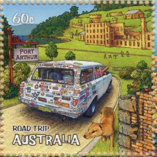 Australia-2012-Road-Trip-Australia-60-cent-Multi-P14-286-x-14-286-White-EH-Holdlen-station-wagon-with-multiple-stickers-among-Port-Arthur-ruins-SG3837